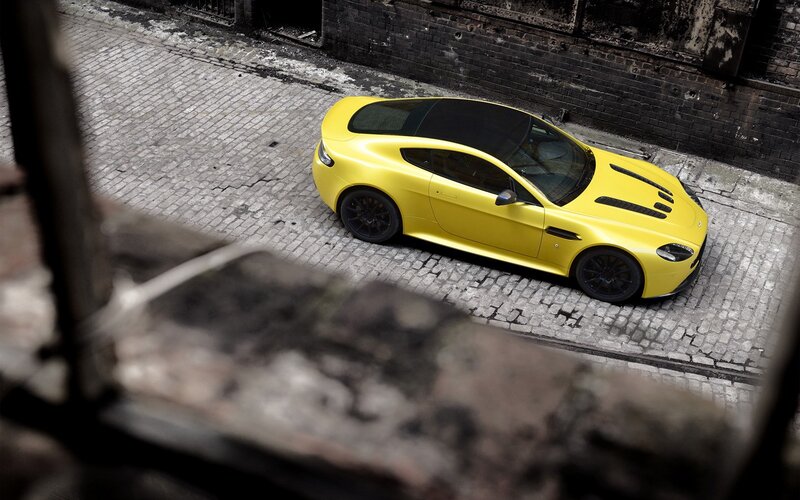 Yellow sports car on cobblestone
