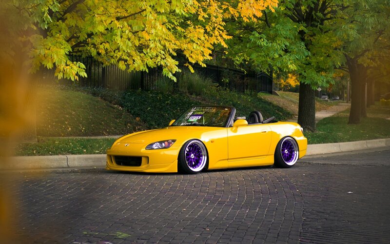 Yellow sports car on cobblestones
