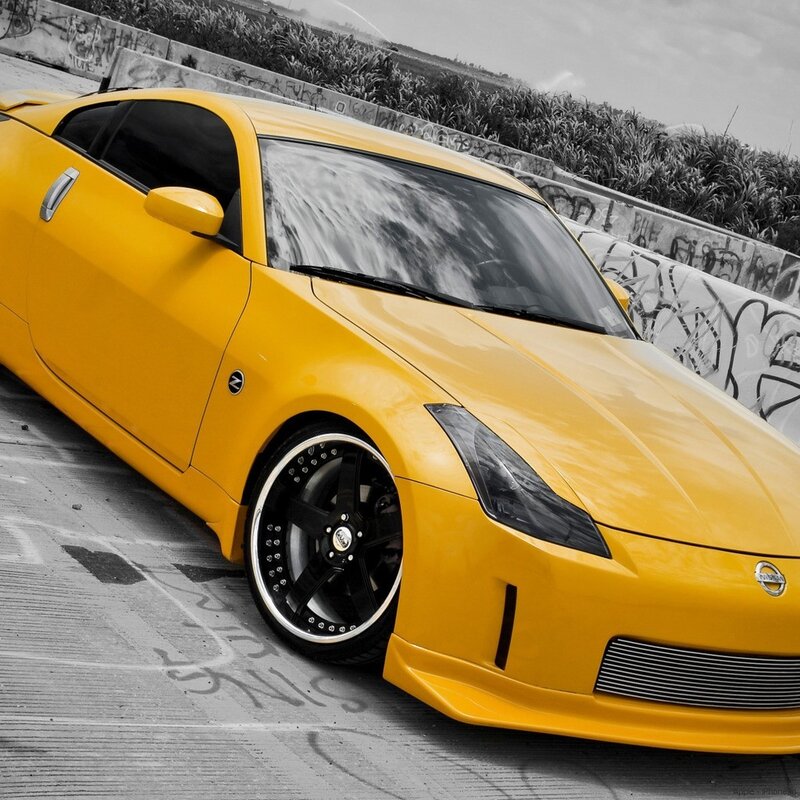 yellow sports car on concrete