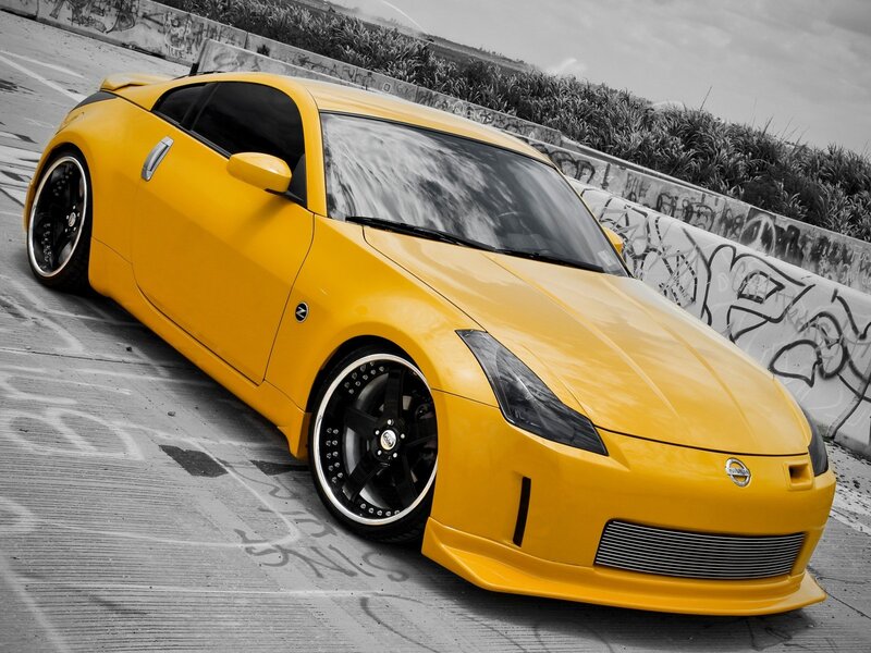 yellow sports car on concrete