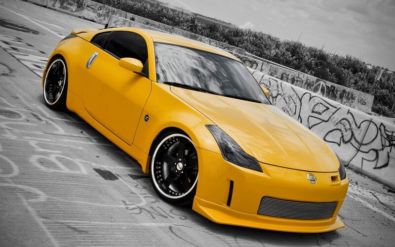 yellow sports car on concrete
