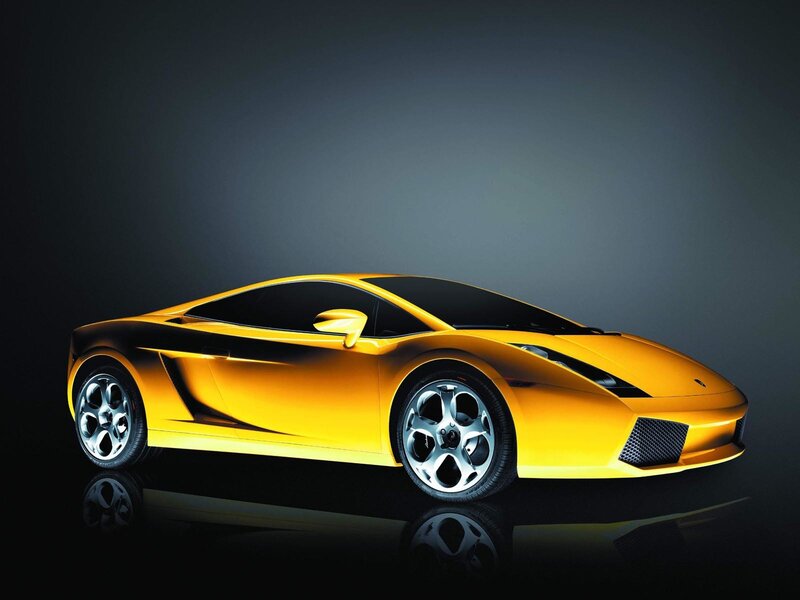 Yellow sports car on dark background