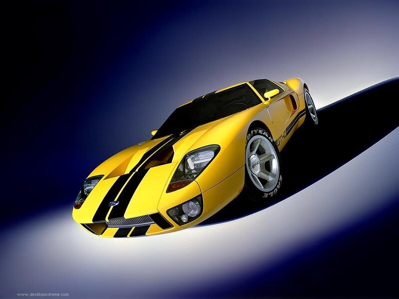 yellow sports car on dark background