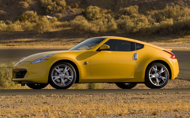 Yellow sports car on desert road