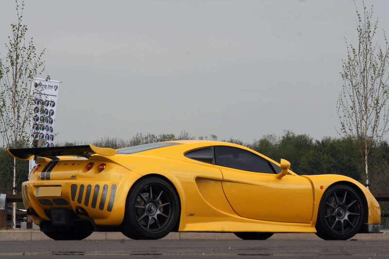 yellow sports car on display