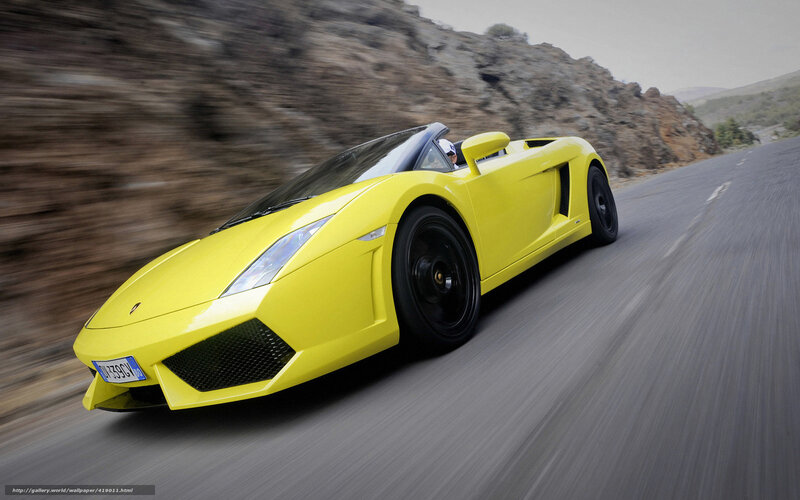 Yellow sports car on mountain road