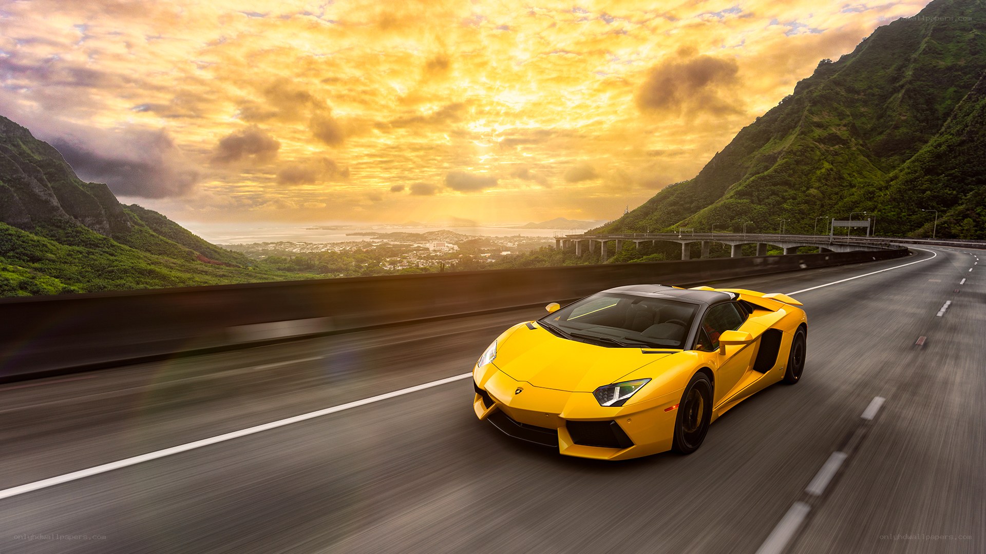 Yellow sports car on mountain road