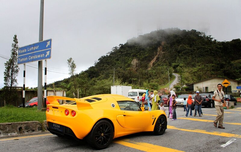 Yellow sports car on mountain road