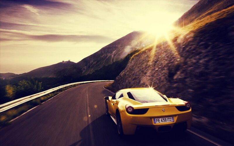 Yellow sports car on mountain road