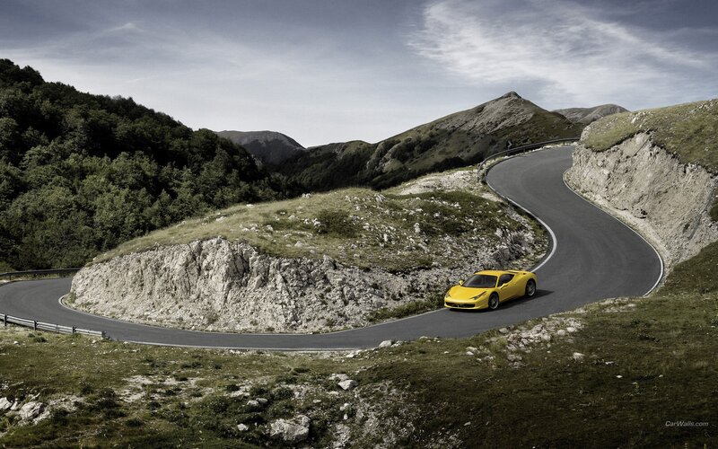 Yellow sports car on mountain road