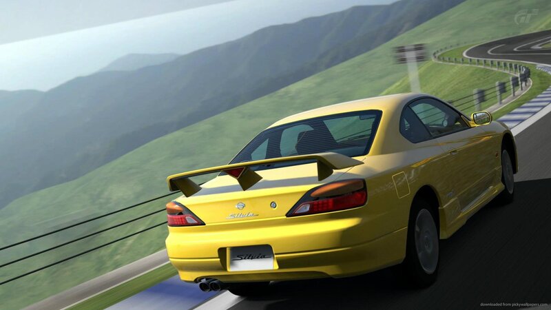 yellow sports car on mountain road