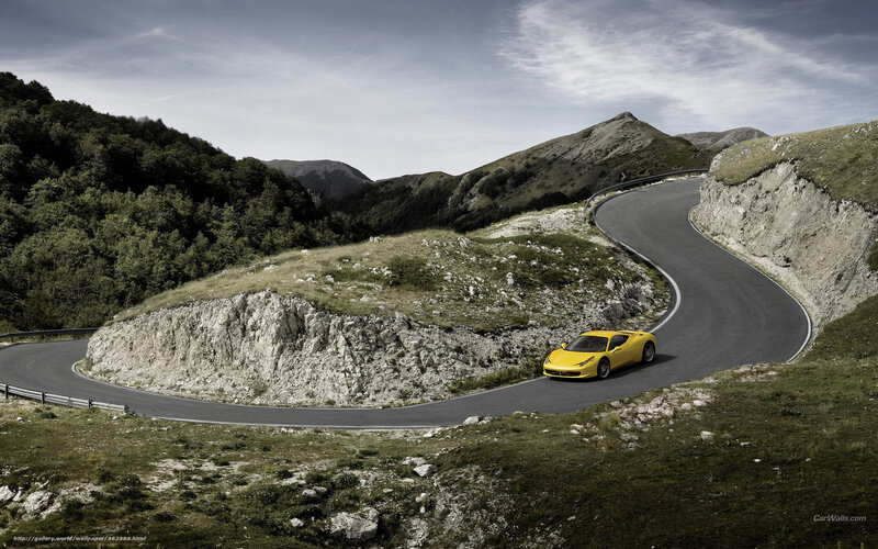 Yellow sports car on mountain road
