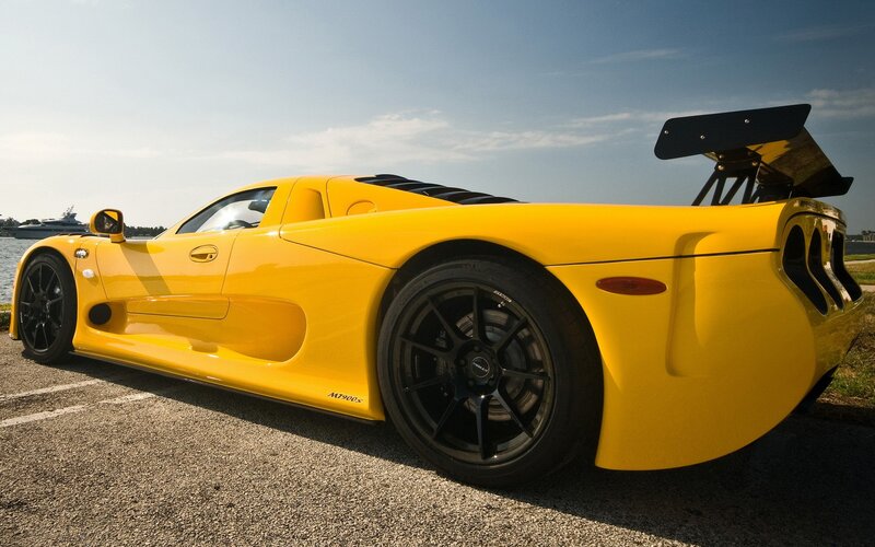Yellow sports car on pavement