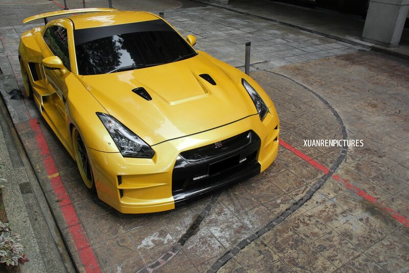 Yellow sports car on pavement