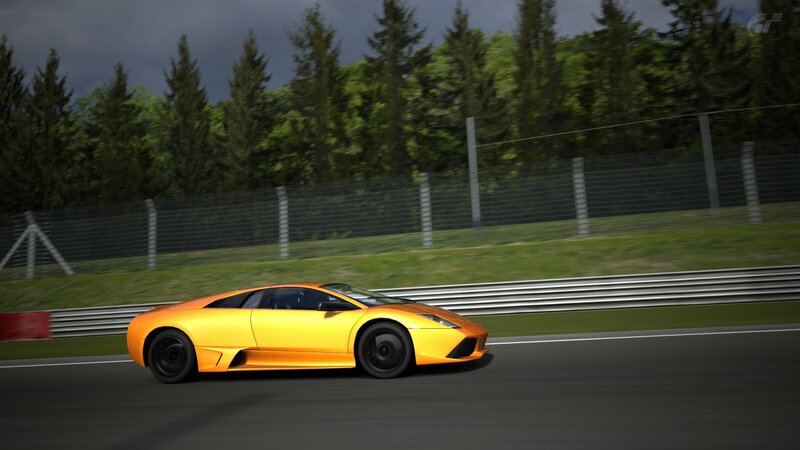 yellow sports car on racetrack