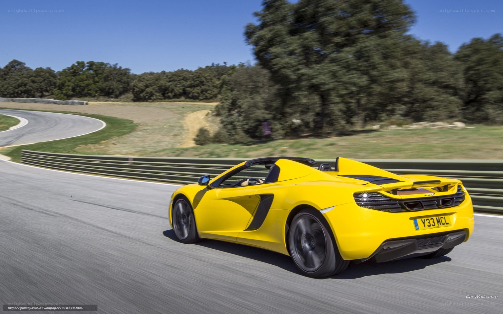 yellow sports car on racetrack