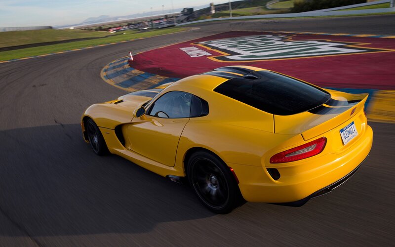 yellow sports car on racetrack