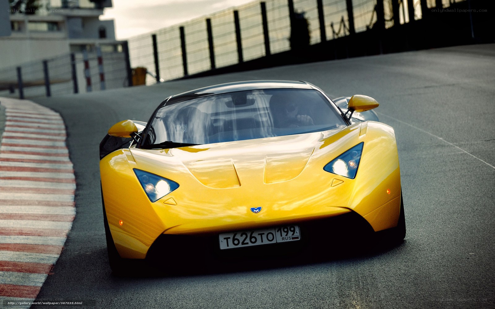 Yellow sports car on racetrack
