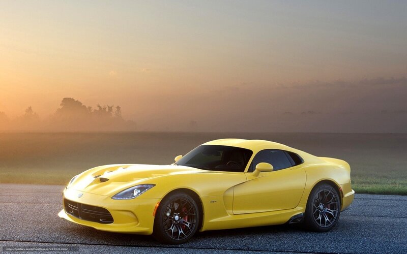 Yellow sports car on road
