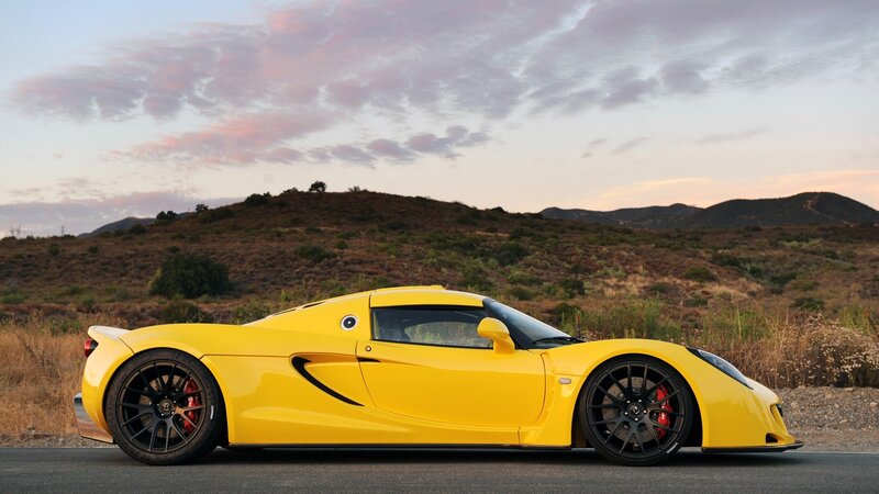 Yellow sports car on road