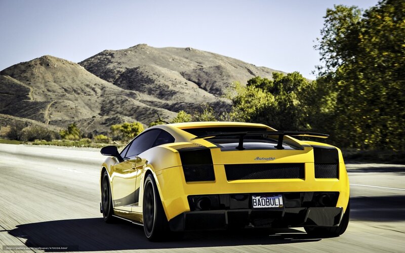 yellow sports car on road