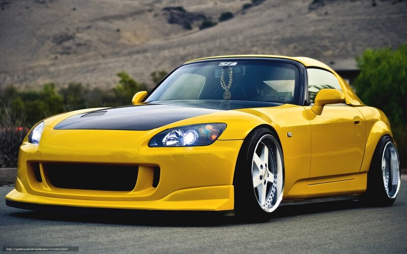 yellow sports car on road