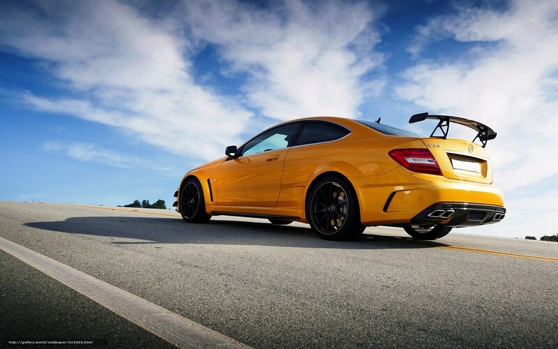 Yellow sports car on road