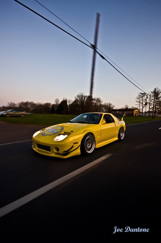 Yellow sports car on road