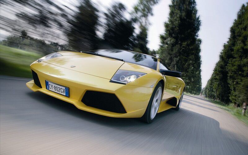 yellow sports car on road