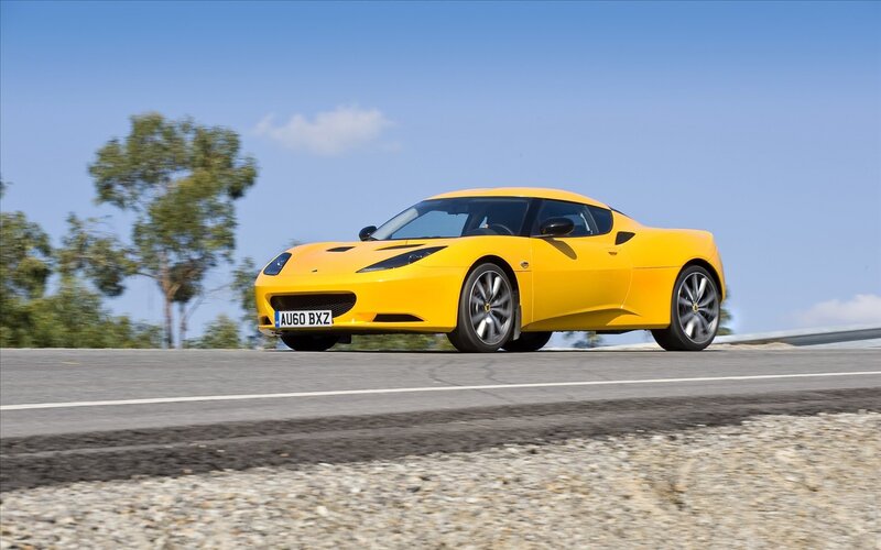 Yellow sports car on road