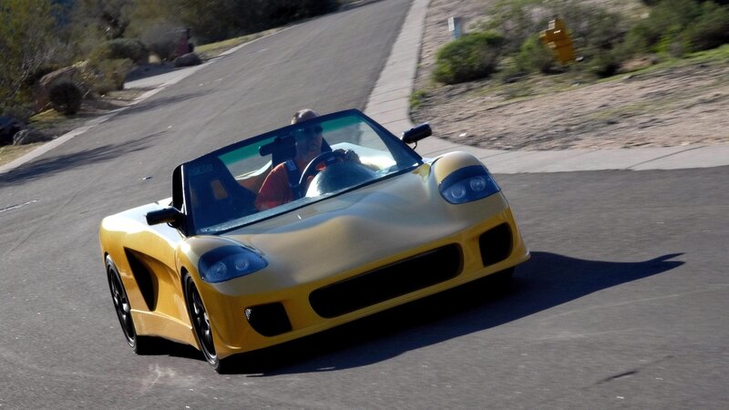yellow sports car on road