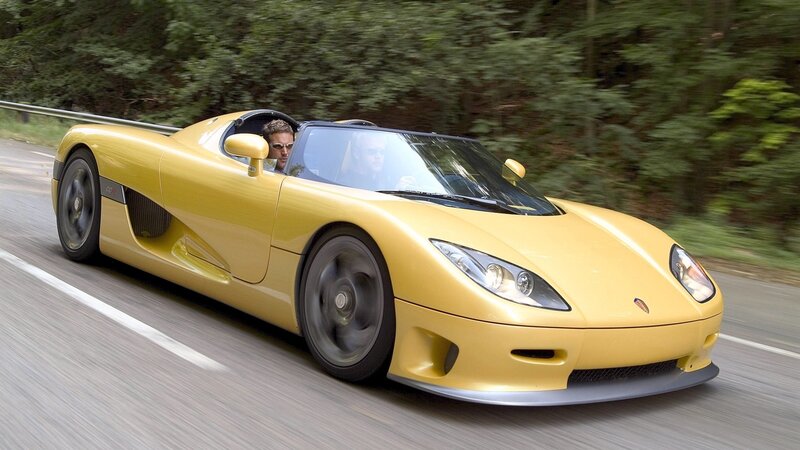 yellow sports car on road