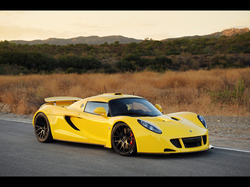 Yellow sports car on road