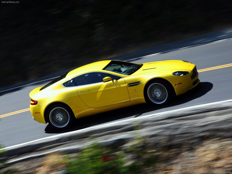 yellow sports car on road