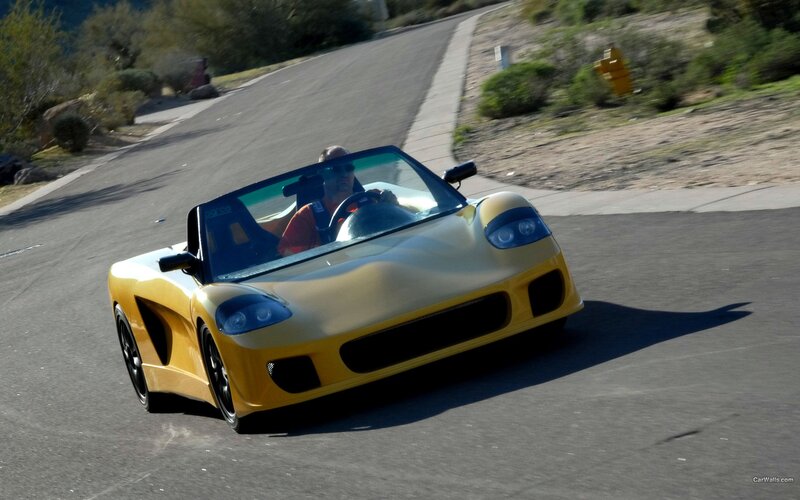 yellow sports car on road