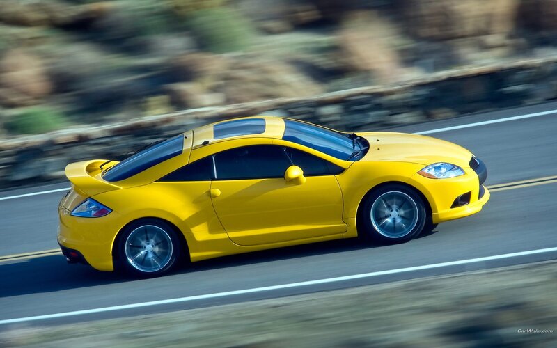 yellow sports car on road