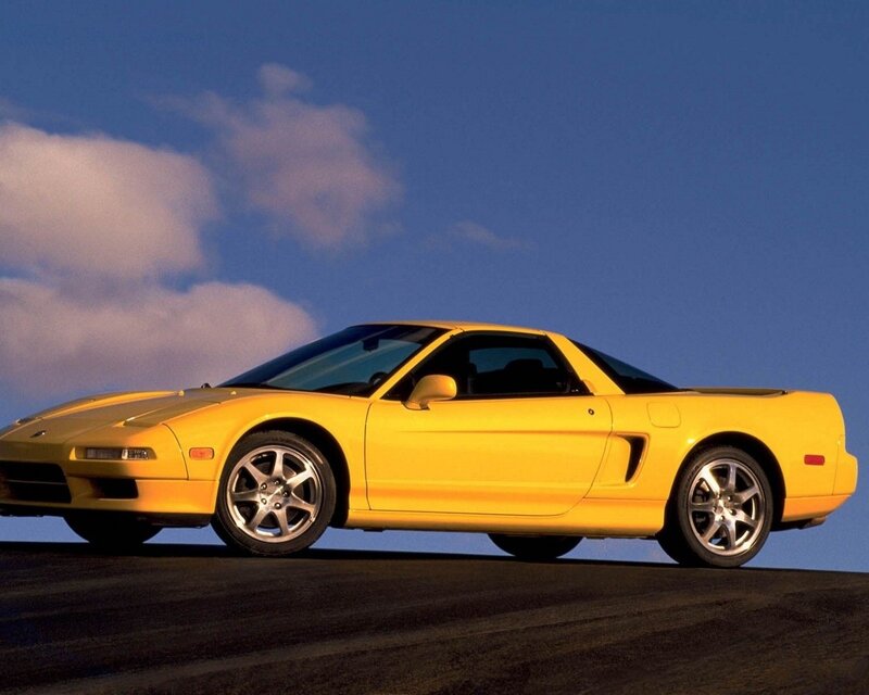 Yellow sports car on road