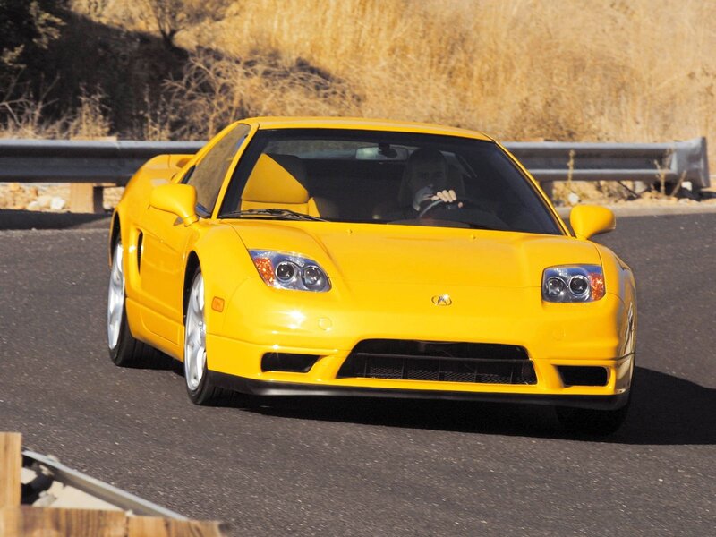 yellow sports car on road