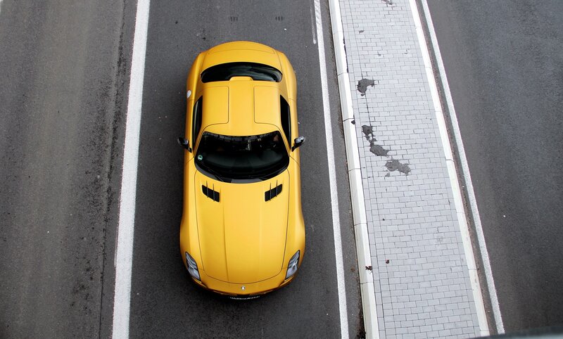 Yellow sports car on road