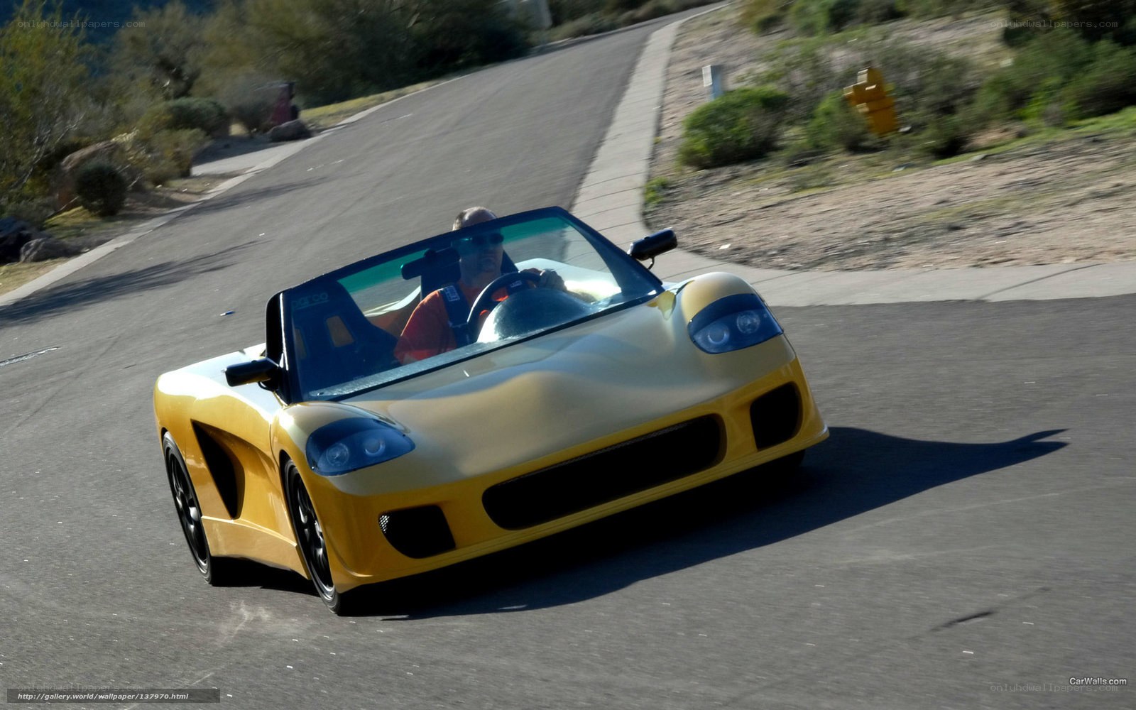 yellow sports car on road
