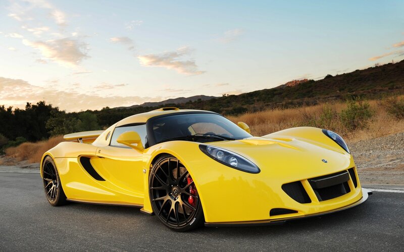 Yellow sports car on road