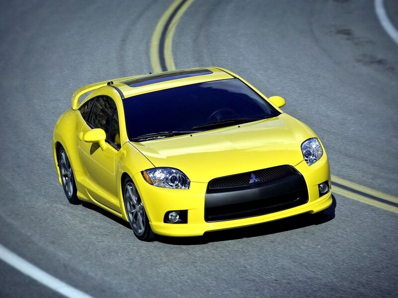 yellow sports car on road
