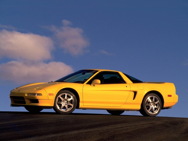 Yellow sports car on road