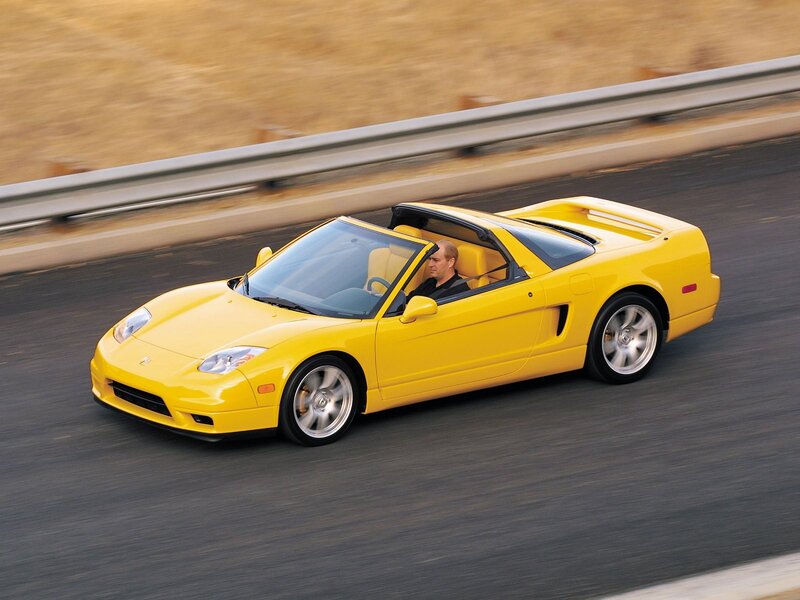 Yellow sports car on road