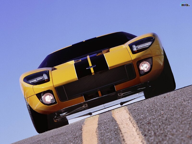 yellow sports car on road