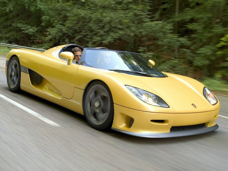 yellow sports car on road