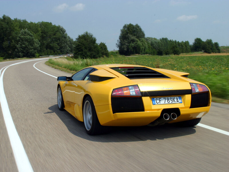 yellow sports car on road