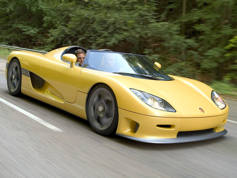 yellow sports car on road