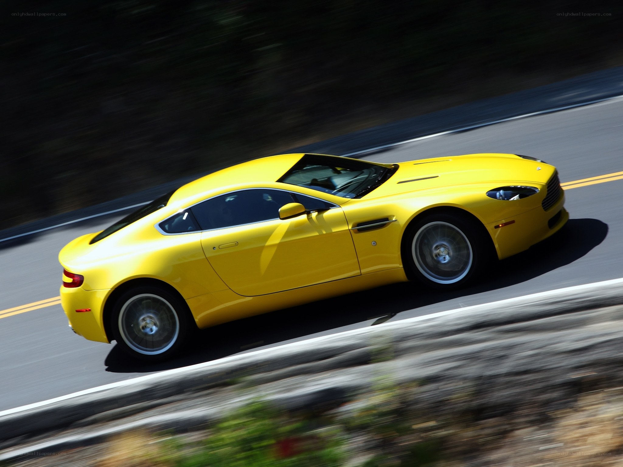 yellow sports car on road