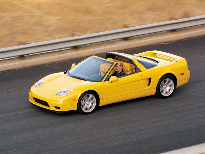 Yellow sports car on road